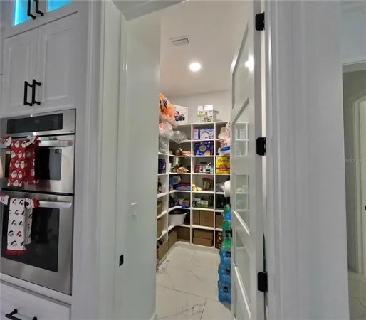a bedroom with a bed and a mirror