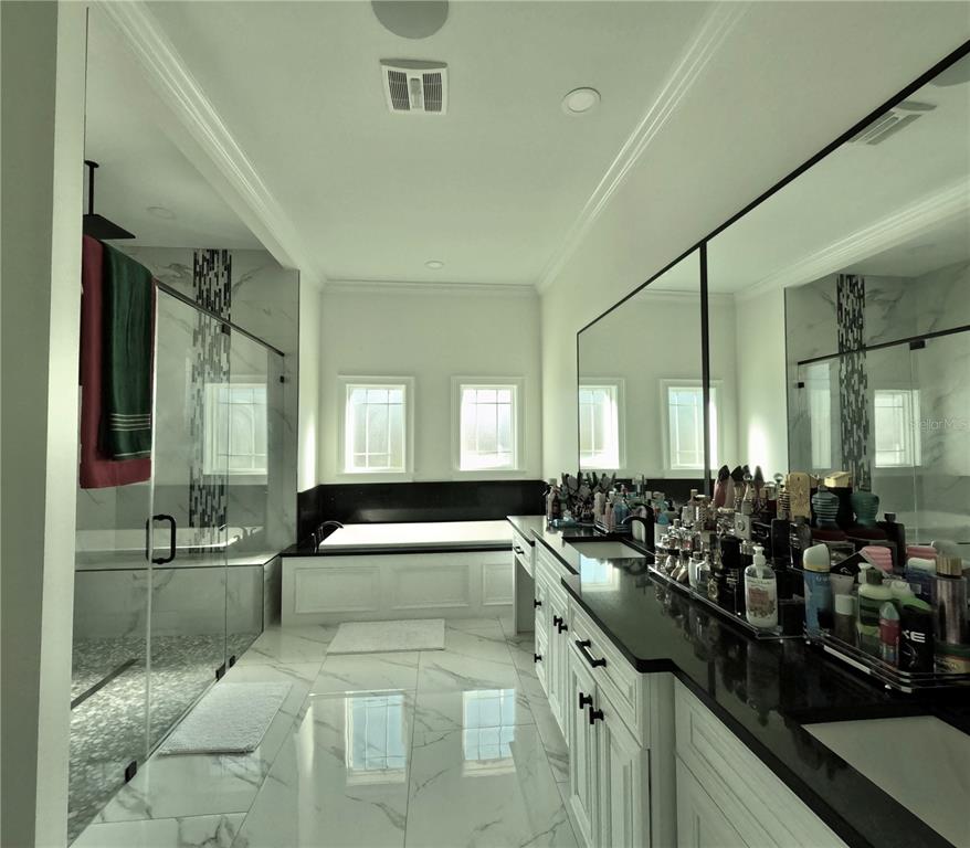 10112 Judy Road Dover, FL 33527 - Photo 36 of 50 a large bedroom with a large window and furniture