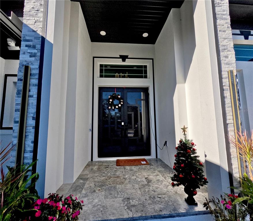 10112 Judy Road Dover, FL 33527 - Photo 4 of 49 a room with painting on the wall and a potted plant