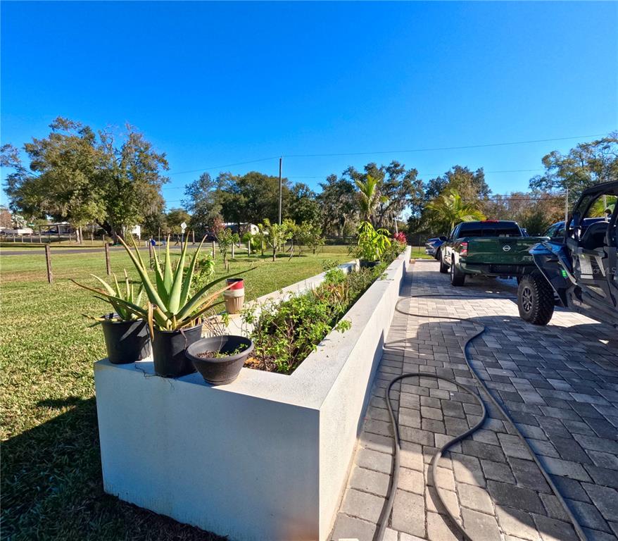 10112 Judy Road Dover, FL 33527 - Photo 7 of 49 a view of a lake with couches and city view
