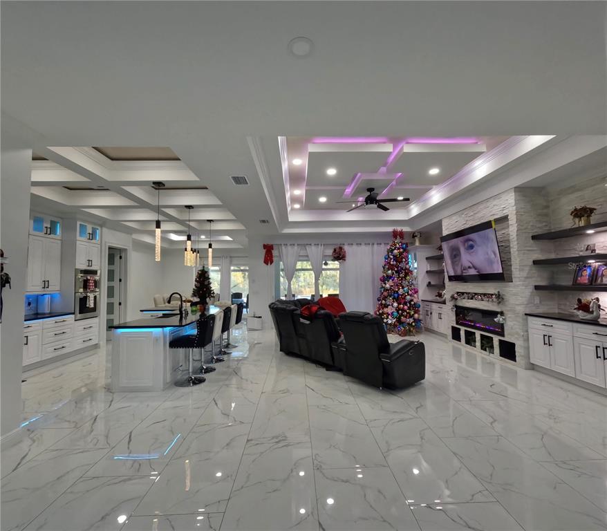 10112 Judy Road Dover, FL 33527 - Photo 9 of 50 a living room with furniture and a flat screen tv