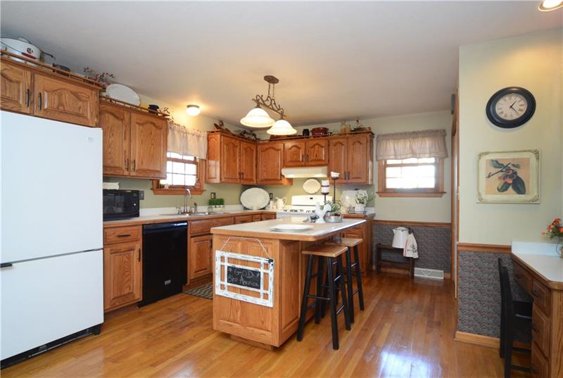 480 Sebring Road Beaver, PA 15009 - Photo 7 of 25 This large kitchen has all the cabinetry you need, plus an island and desk area.