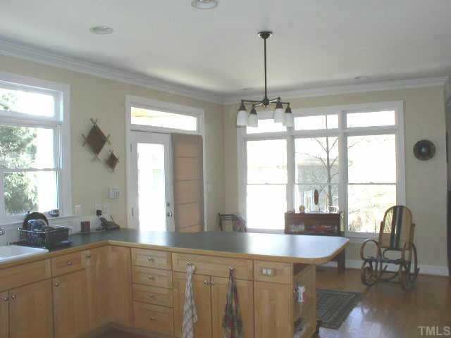217 Stable Road Carrboro, NC 27510 - Photo 4 of 10 Breakfast room off of the kitchen has doors leading to patio and back yard.
