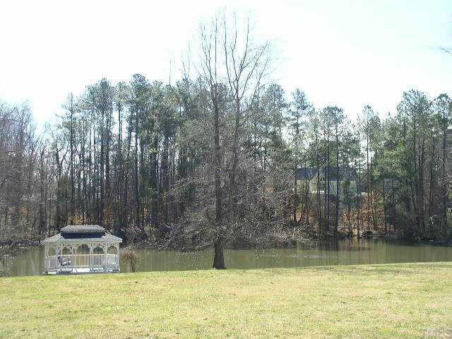 217 Stable Road Carrboro, NC 27510 - Photo 10 of 10 Neighborhood pond, gazebo and field available for all in the neighborhood to enjoy.