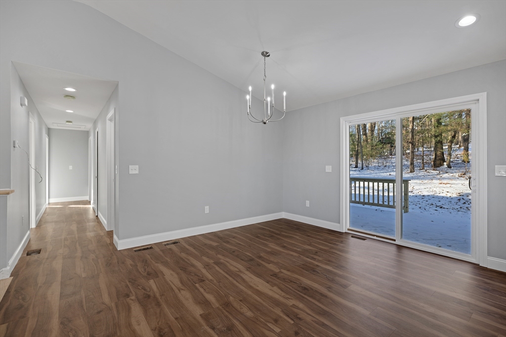 132 Kibbe Road East Longmeadow, MA 01028 - Photo 16 of 32 a view of an empty room with wooden floor and a window