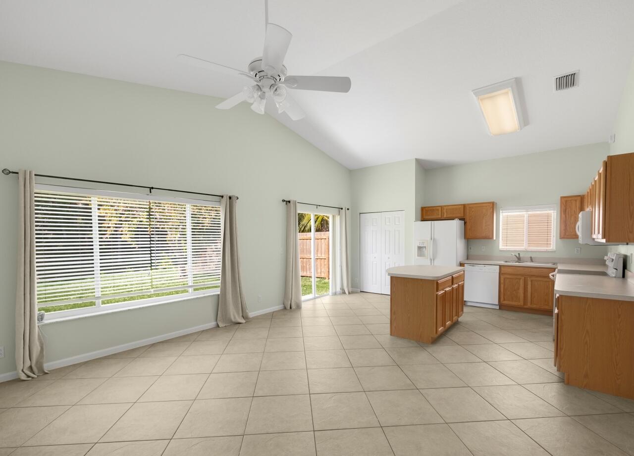 2450 Southeast Springtree Place Stuart, FL 34997 - Photo 18 of 23 a living room with furniture and window