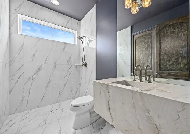 a picture of a bathroom with a shower