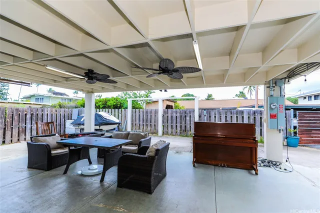 a view of a patio with a table and chairs