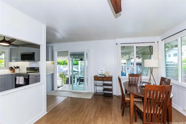 a view of a dining room with furniture window and wooden floor