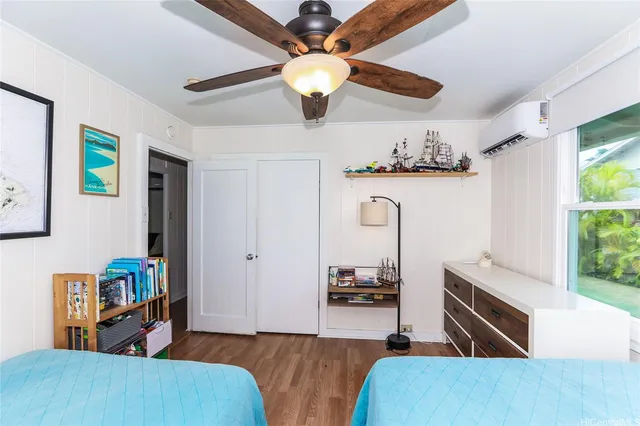 a living room with furniture and flat screen tv