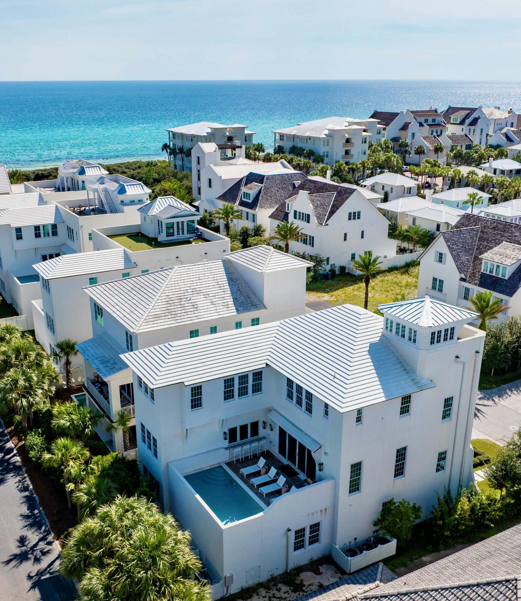an aerial view of a house with a swimming pool yard and outdoor seating
