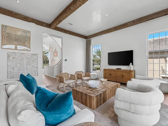 a bathroom with a granite countertop sink and a large window