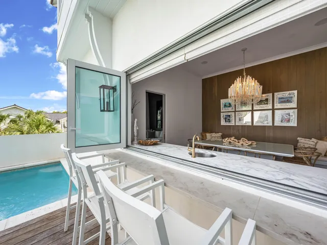 a bedroom with a large bed and a large window