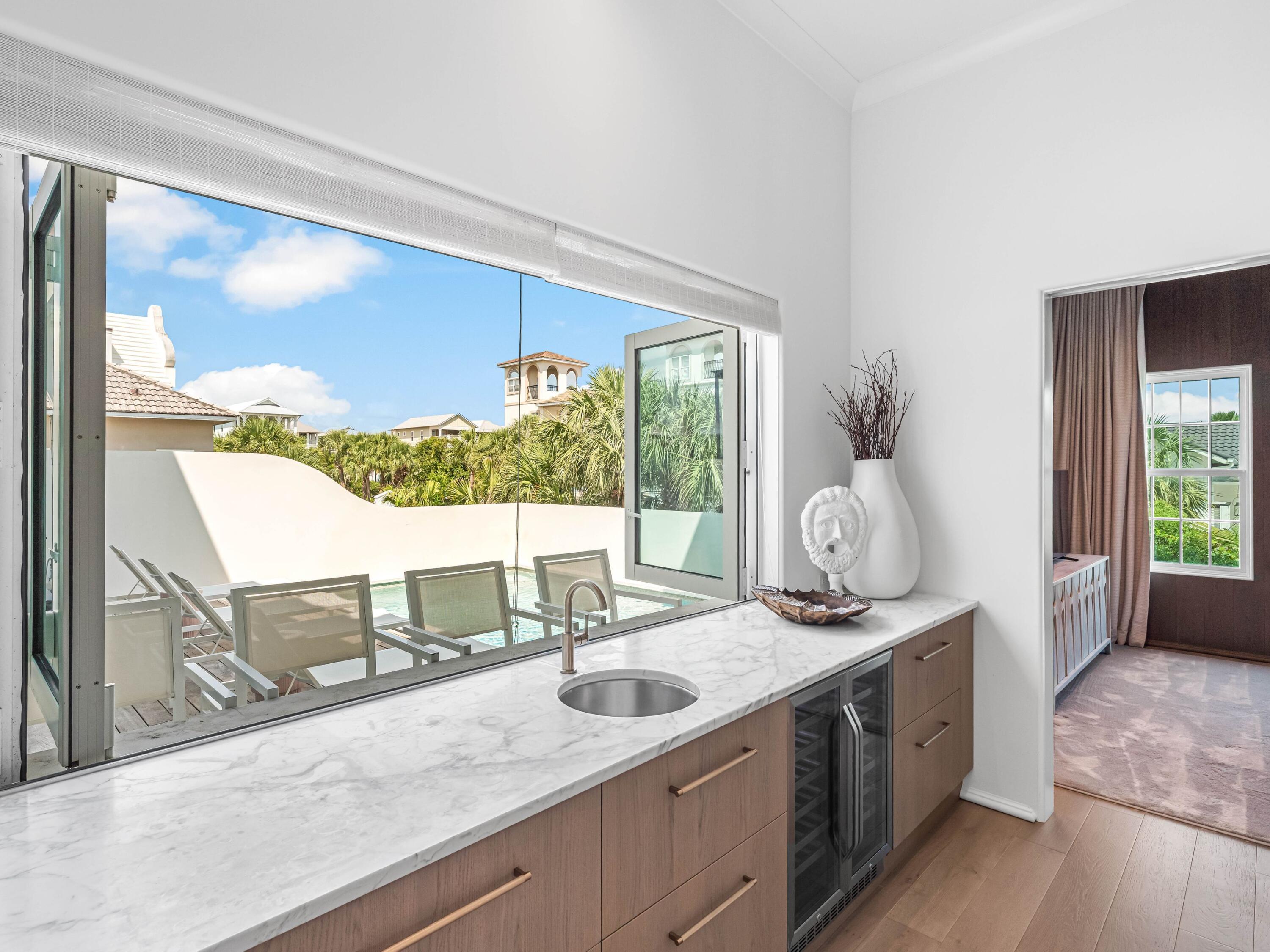 41 Elysee Ct Inlet Beach Inlet Beach, FL 32461 - Photo 17 of 68 a bathroom with a granite countertop sink and a large window