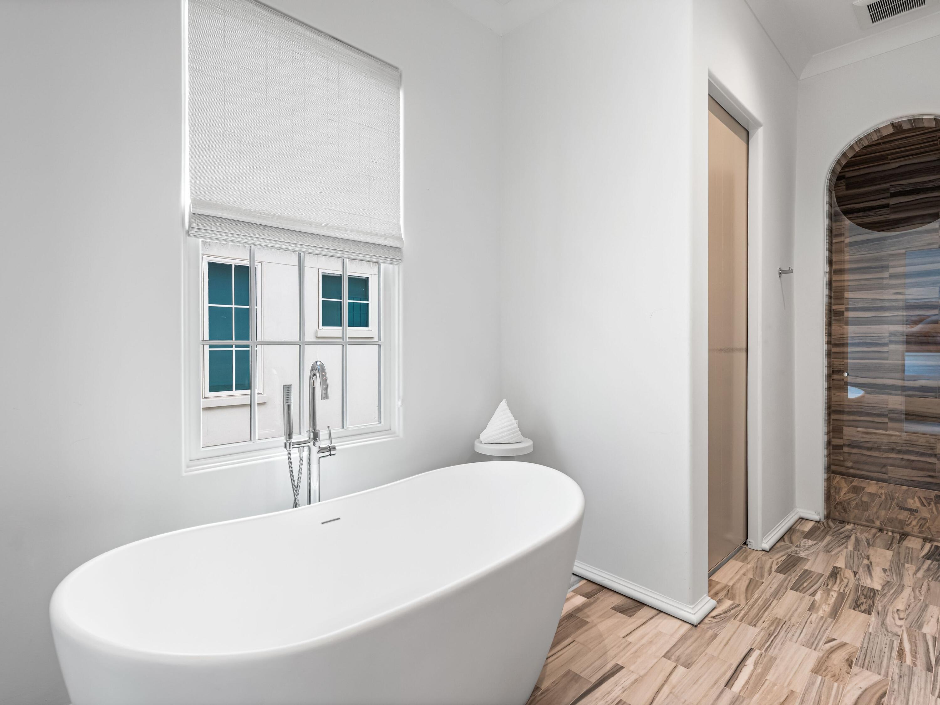 41 Elysee Ct Inlet Beach Inlet Beach, FL 32461 - Photo 25 of 68 a bathroom with a bathtub and a sink