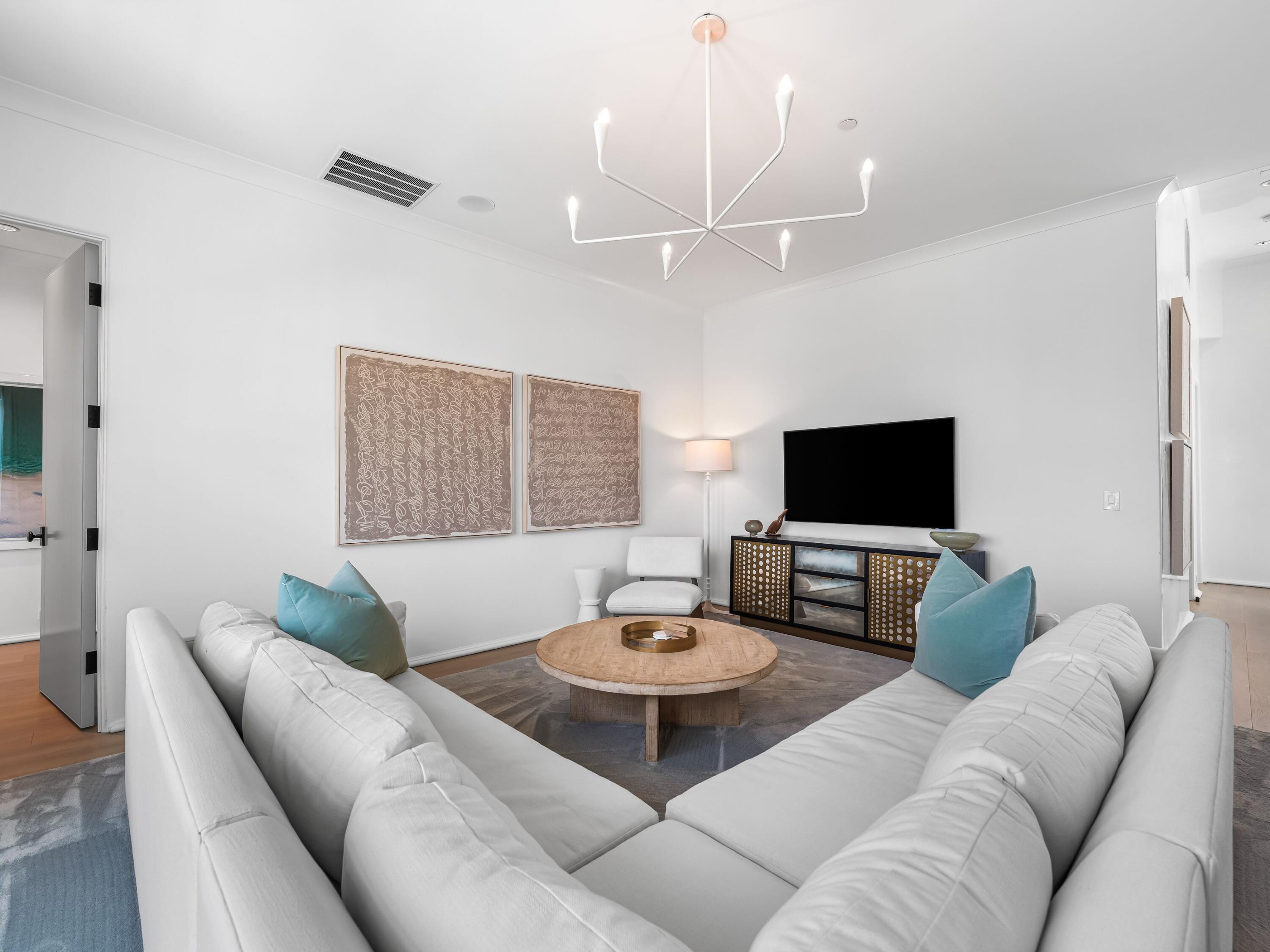 41 Elysee Ct Inlet Beach Inlet Beach, FL 32461 - Photo 45 of 68 a living room with furniture and a flat screen tv