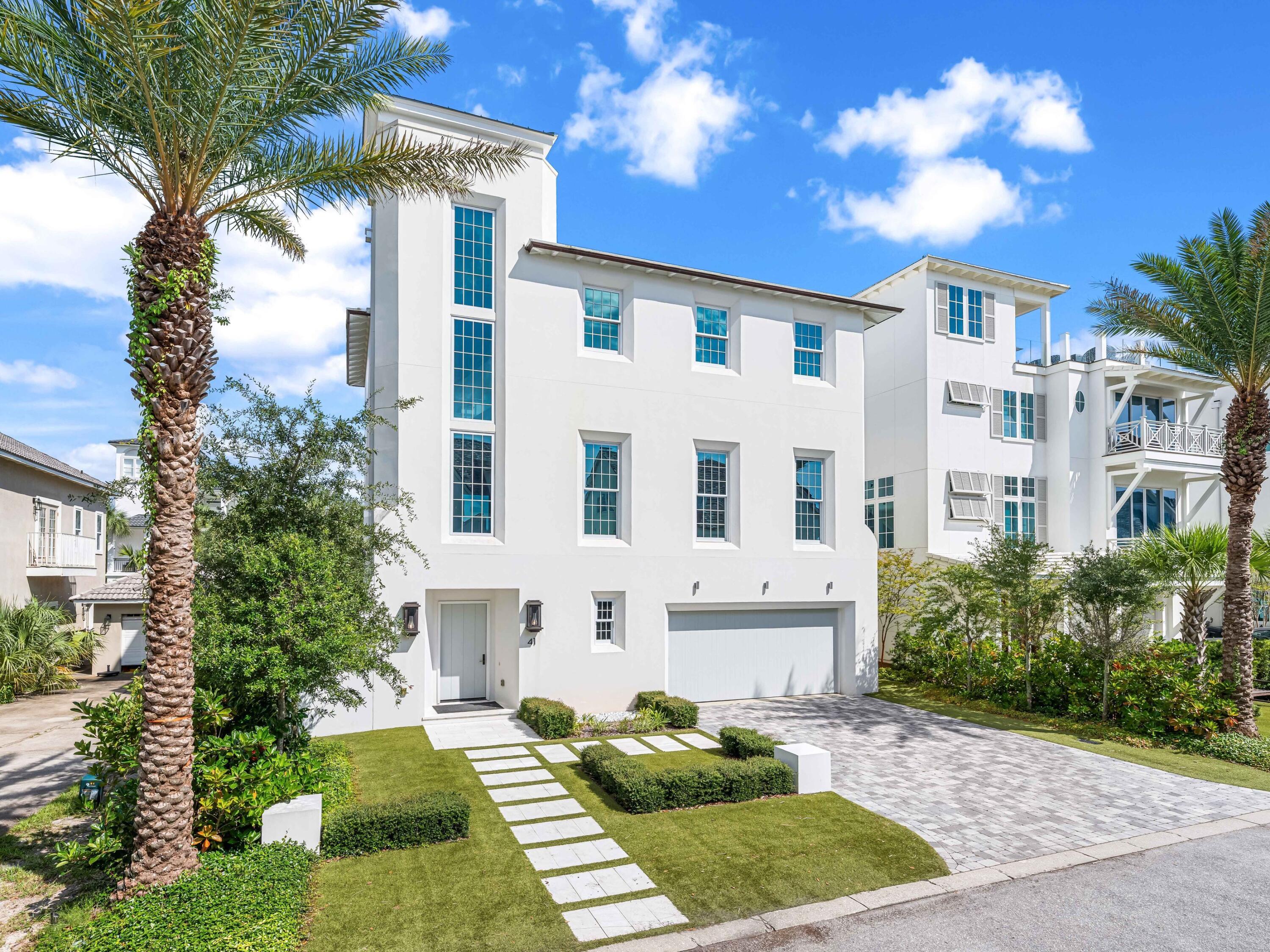 41 Elysee Ct Inlet Beach Inlet Beach, FL 32461 - Photo 57 of 68 a view of a white house with a yard and plants