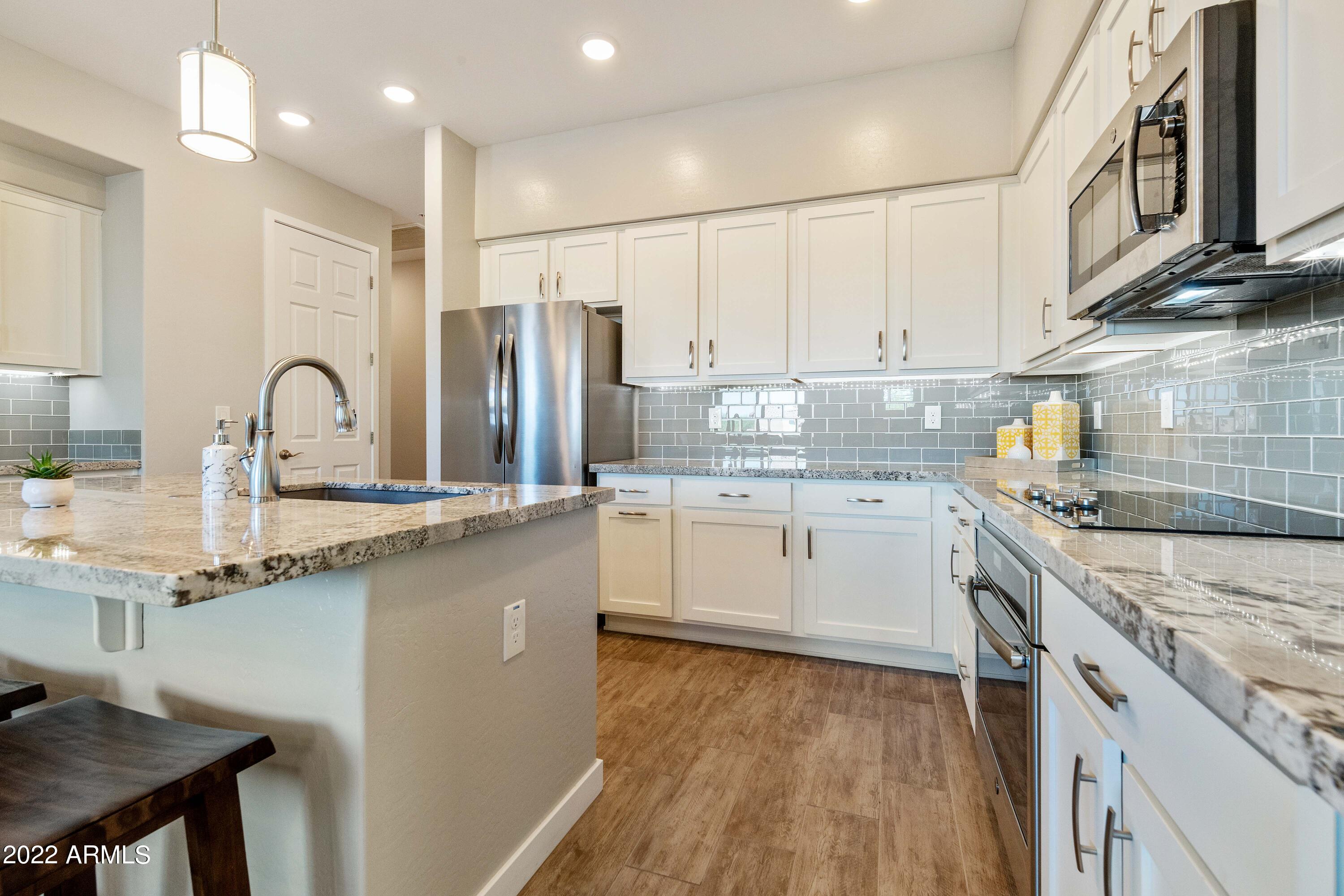 250 West Queen Creek Road, Unit 201 Chandler, AZ 85248 - Photo 12 of 29 Granite Countertops & Glass Backsplash