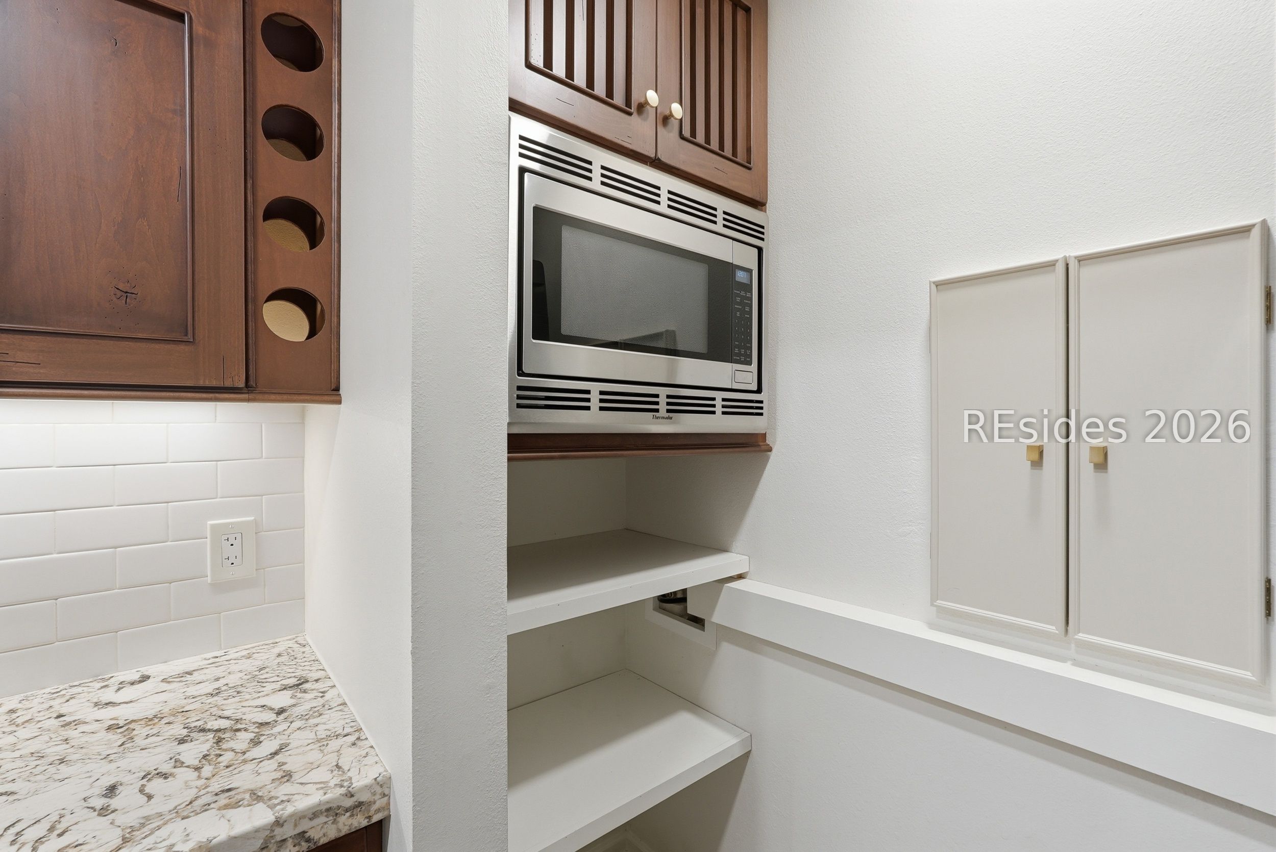897 Fording Island Road, Unit 1303 Bluffton, SC 29910 - Photo 16 of 48 Thermidor microwave and custom storage shelves.