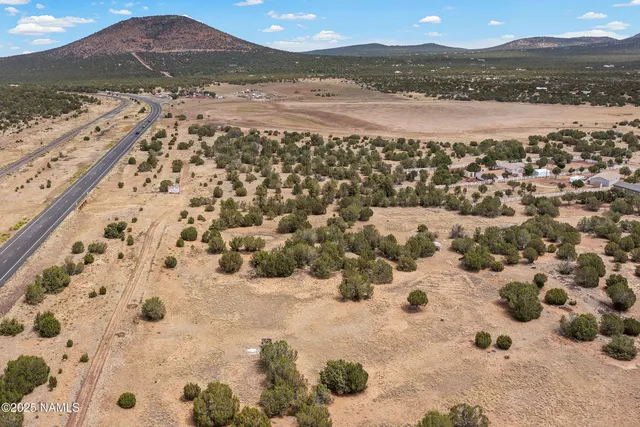 a view of an ocean and a mountain