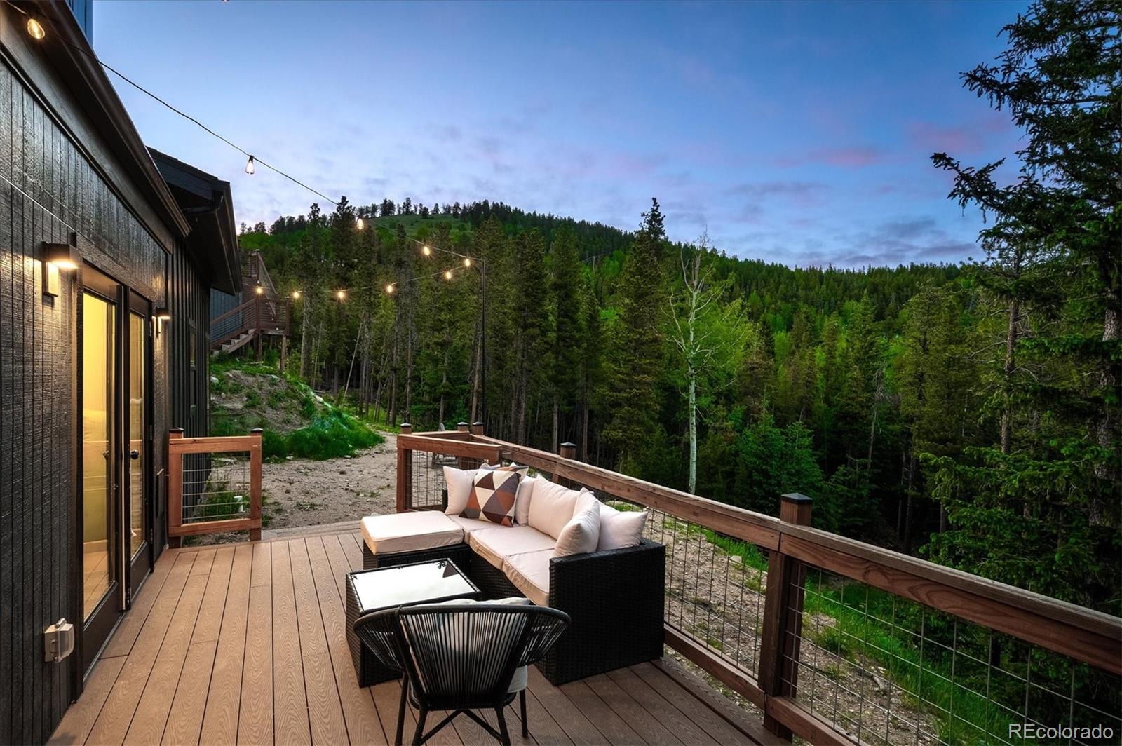 1633 Sinton Road Evergreen, CO 80439 - Photo 6 of 50 a view of a chairs on the roof deck
