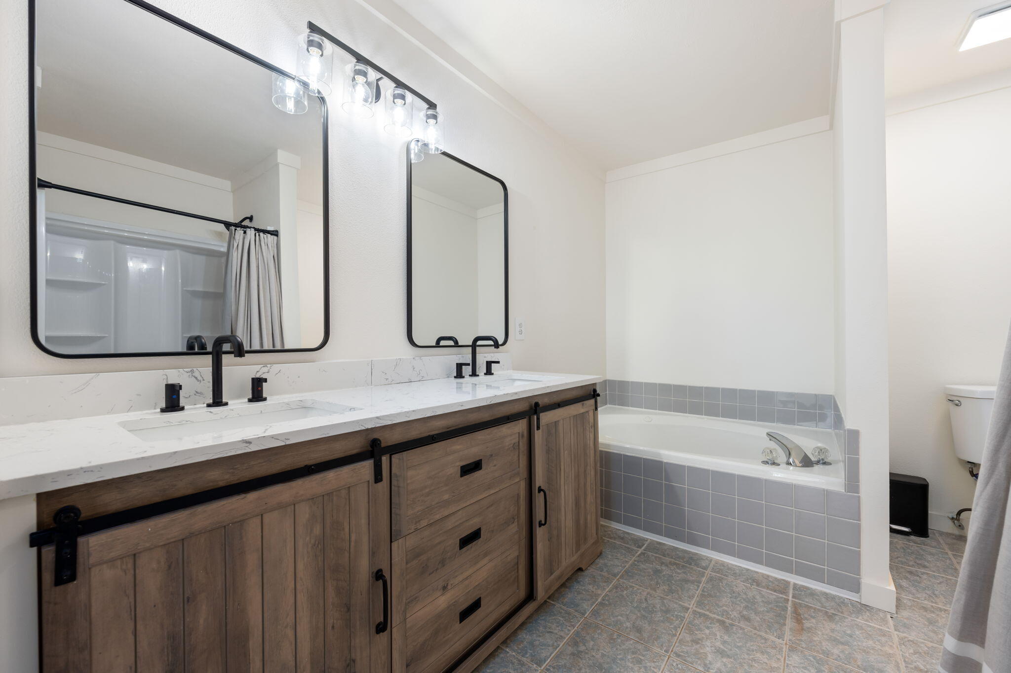 3421 Gardenview Road Pace, FL 32571 - Photo 17 of 26 a bathroom with a double vanity sink mirror double and bathtub