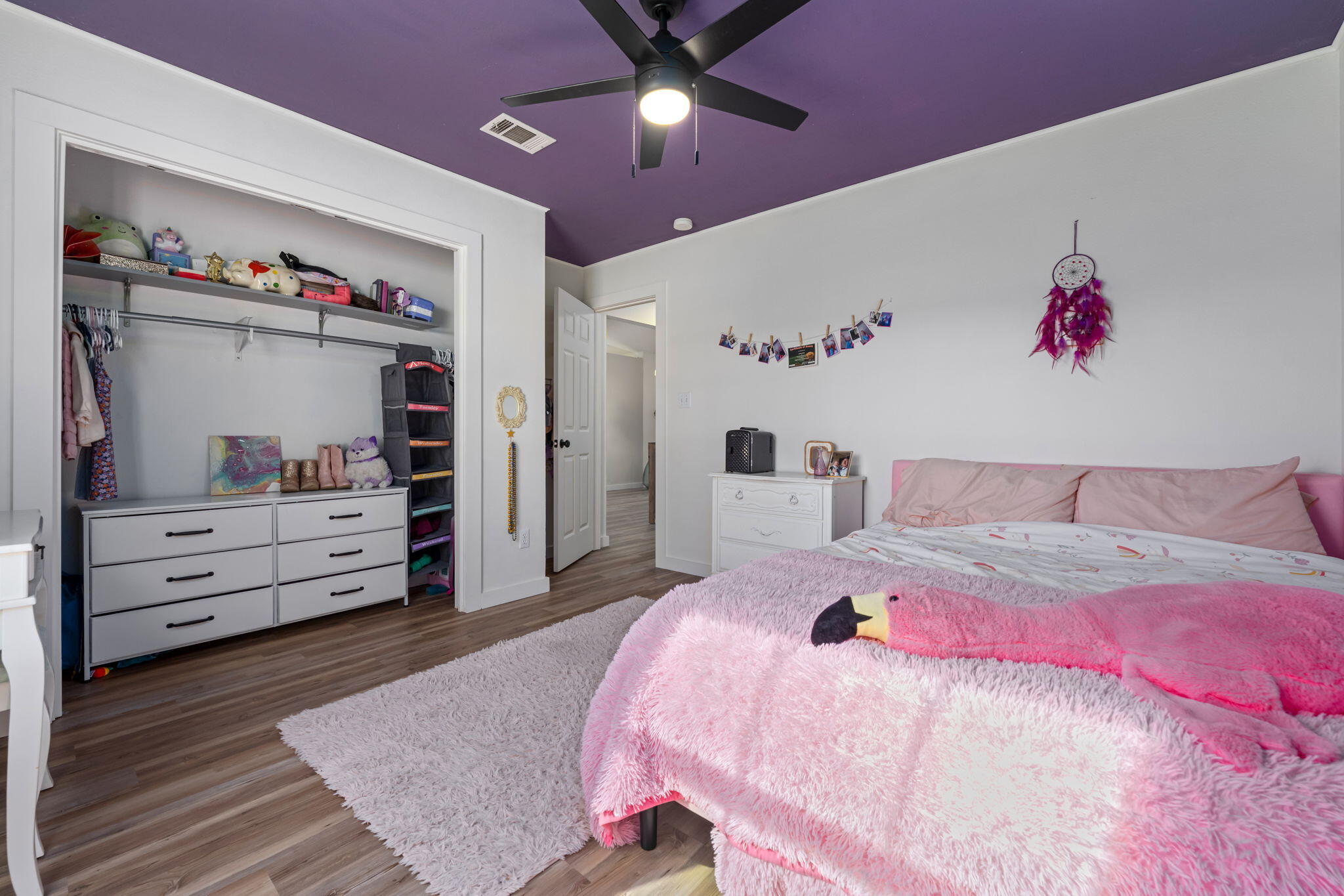 3421 Gardenview Road Pace, FL 32571 - Photo 21 of 26 a bedroom with a bed and a walk in closet