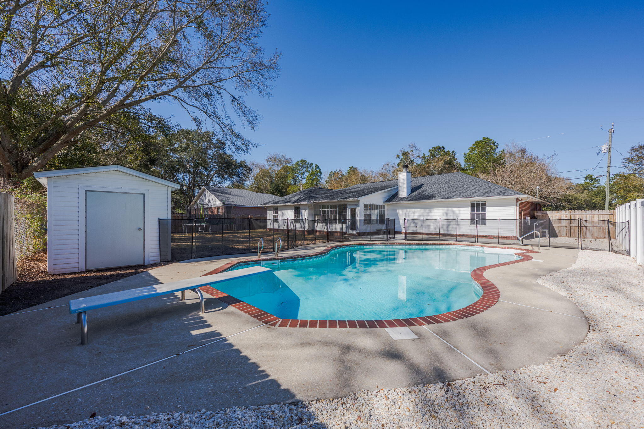 3421 Gardenview Road Pace, FL 32571 - Photo 24 of 26 a swimming pool with outdoor seating and yard