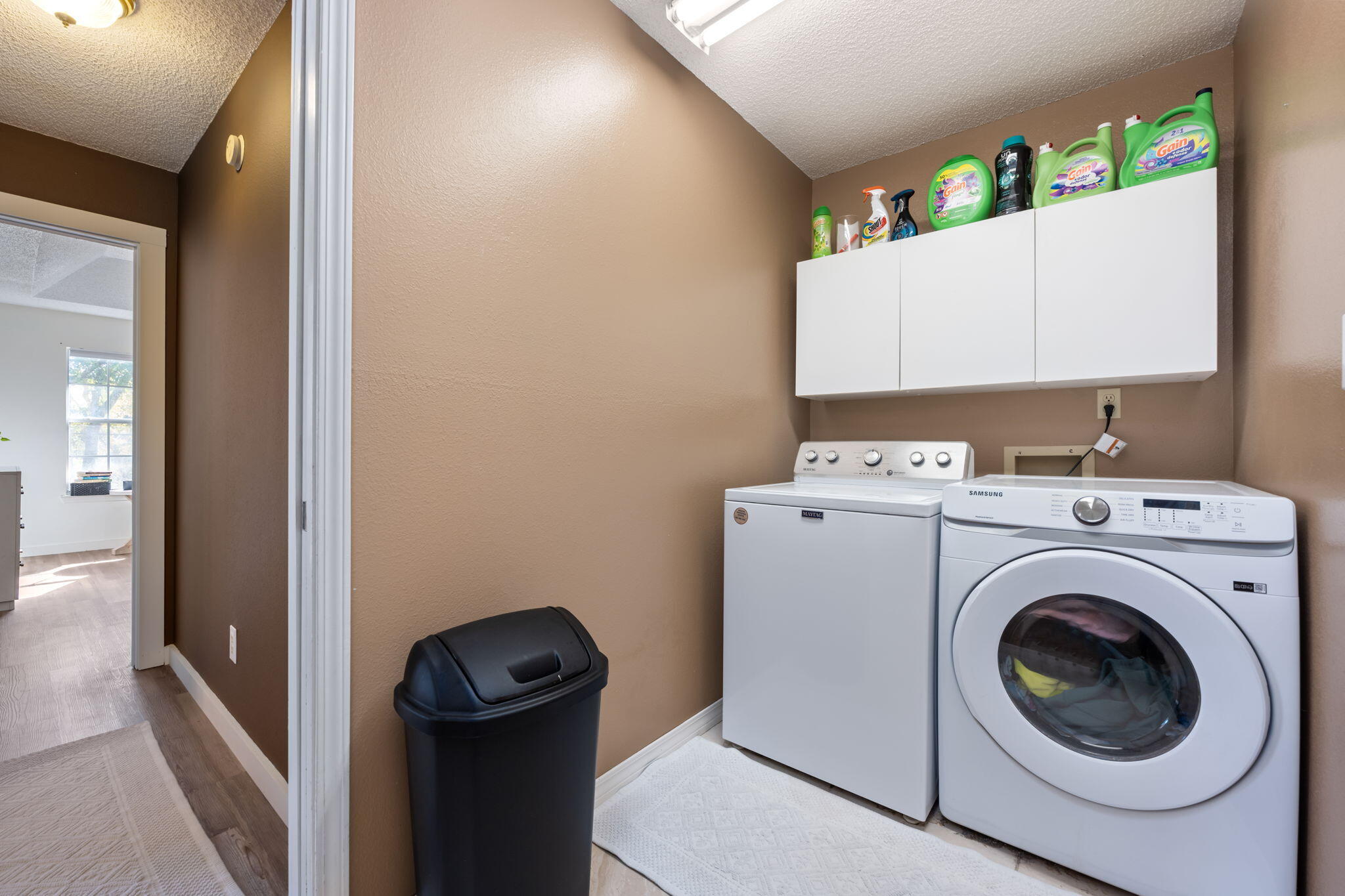 3421 Gardenview Road Pace, FL 32571 - Photo 26 of 26 a view of a hallway with washer and dryer
