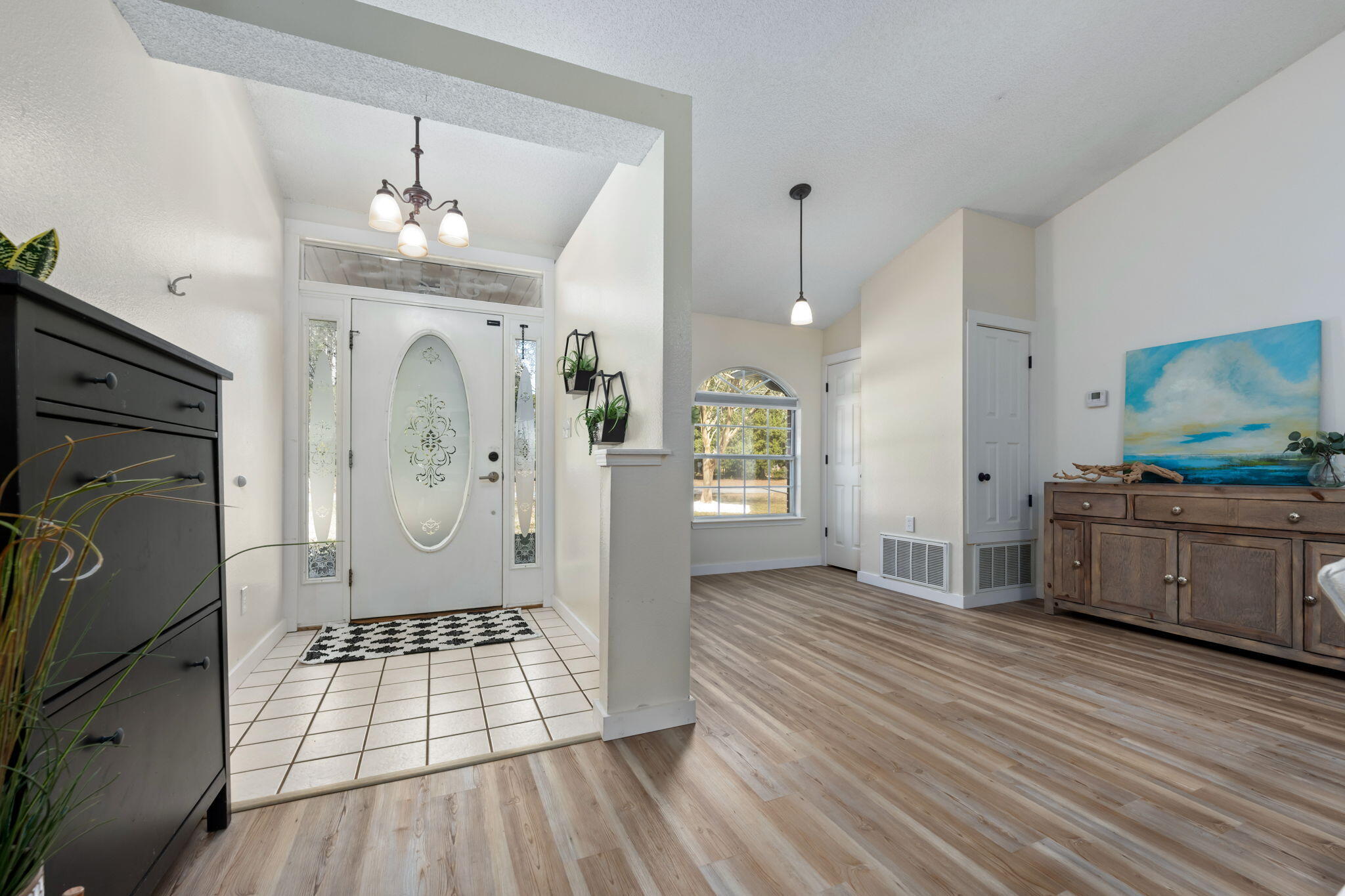 3421 Gardenview Road Pace, FL 32571 - Photo 4 of 26 a living room with furniture and a wooden floor