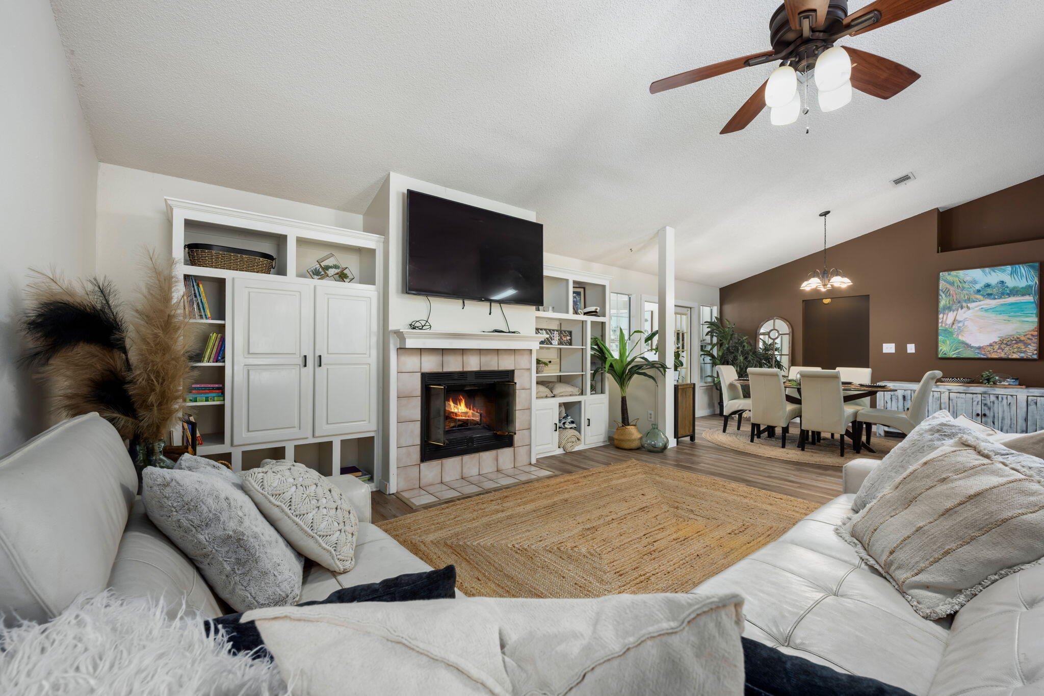 3421 Gardenview Road Pace, FL 32571 - Photo 6 of 26 a living room with furniture a fireplace and a flat screen tv