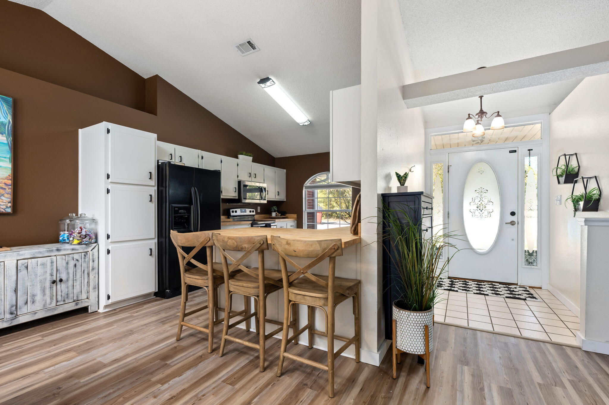 3421 Gardenview Road Pace, FL 32571 - Photo 8 of 26 a view of a dining room with furniture and wooden floor
