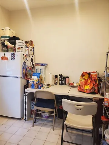 a room with furniture a washer and dryer