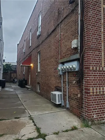 a view of a brick building with an outdoor space
