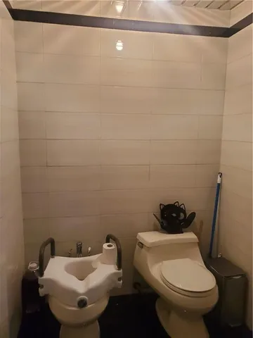 a bathroom with a toilet and a sink