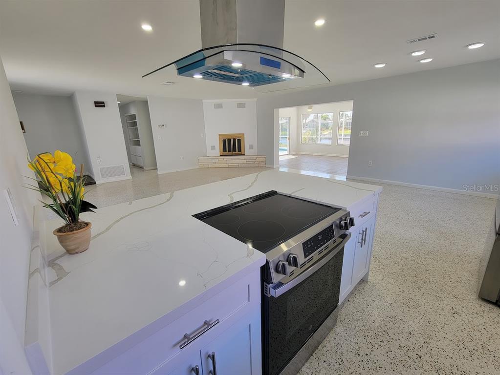 1732 Boca Raton Court Punta Gorda, FL 33950 - Photo 25 of 64 a kitchen with stainless steel appliances granite countertop a stove a sink and a refrigerator
