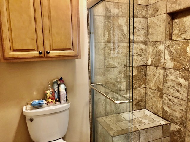 1089 General George Patton Road Nashville, TN 37221 - Photo 8 of 14 a bathroom with a sink a toilet and shower curtain