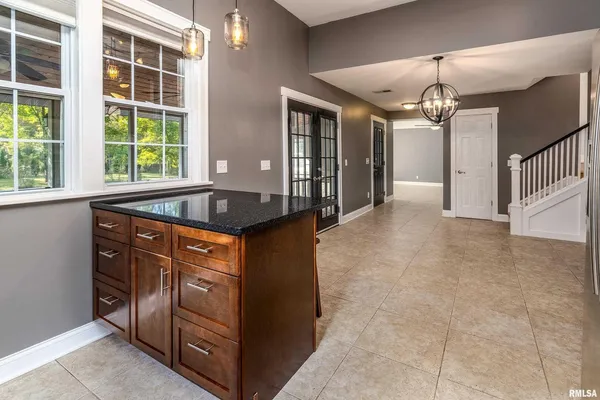 a view of a kitchen counter space with windows