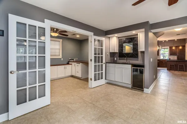 a view of a kitchen with counter top space and stainless steel appliances