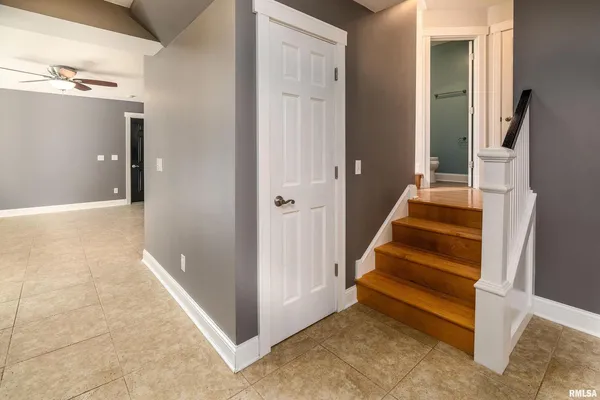 a view of a hallway with stairs