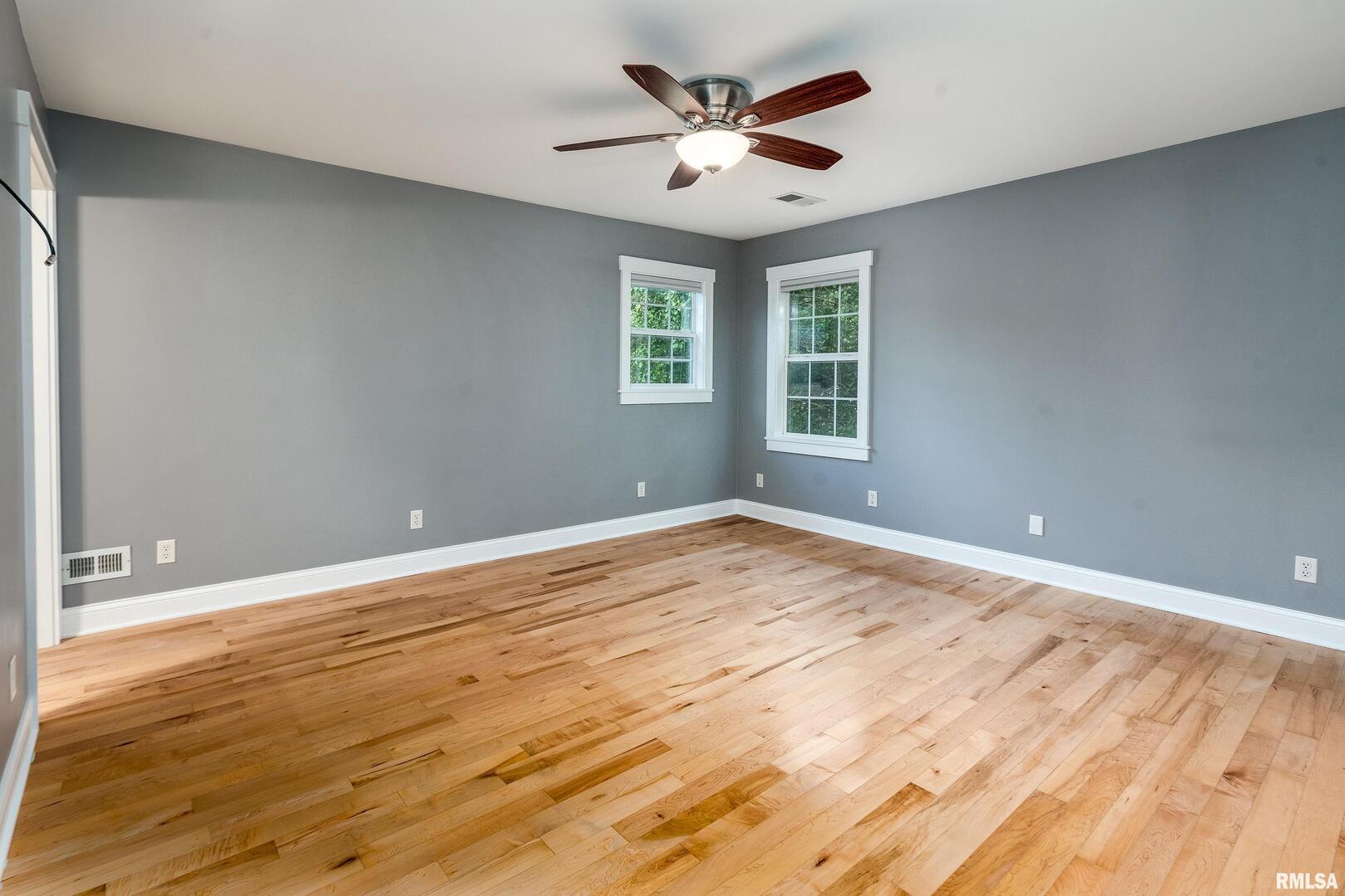 1591 North Reed Station Road Carbondale, IL 62901 - Photo 22 of 44 a view of an empty room with wooden floor and a window