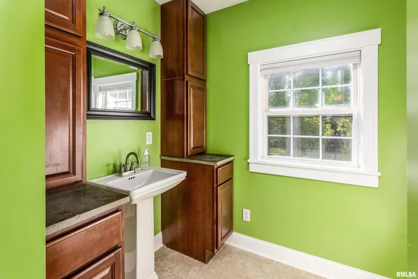 a bathroom with a sink and a mirror