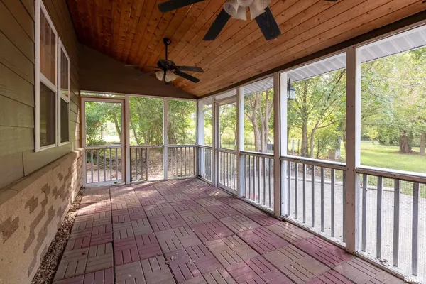 a view of a porch with wooden floor