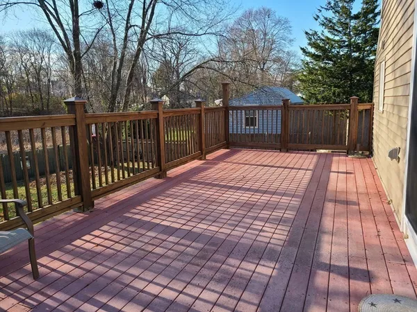 a view of wooden floor with a wooden fence