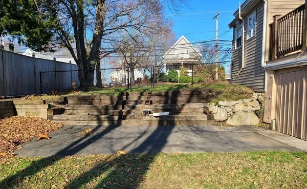 a view of a yard with furniture