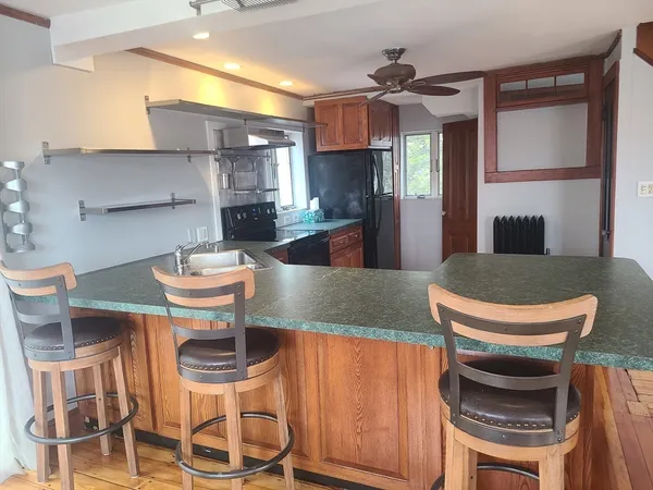 a kitchen with a table and chairs