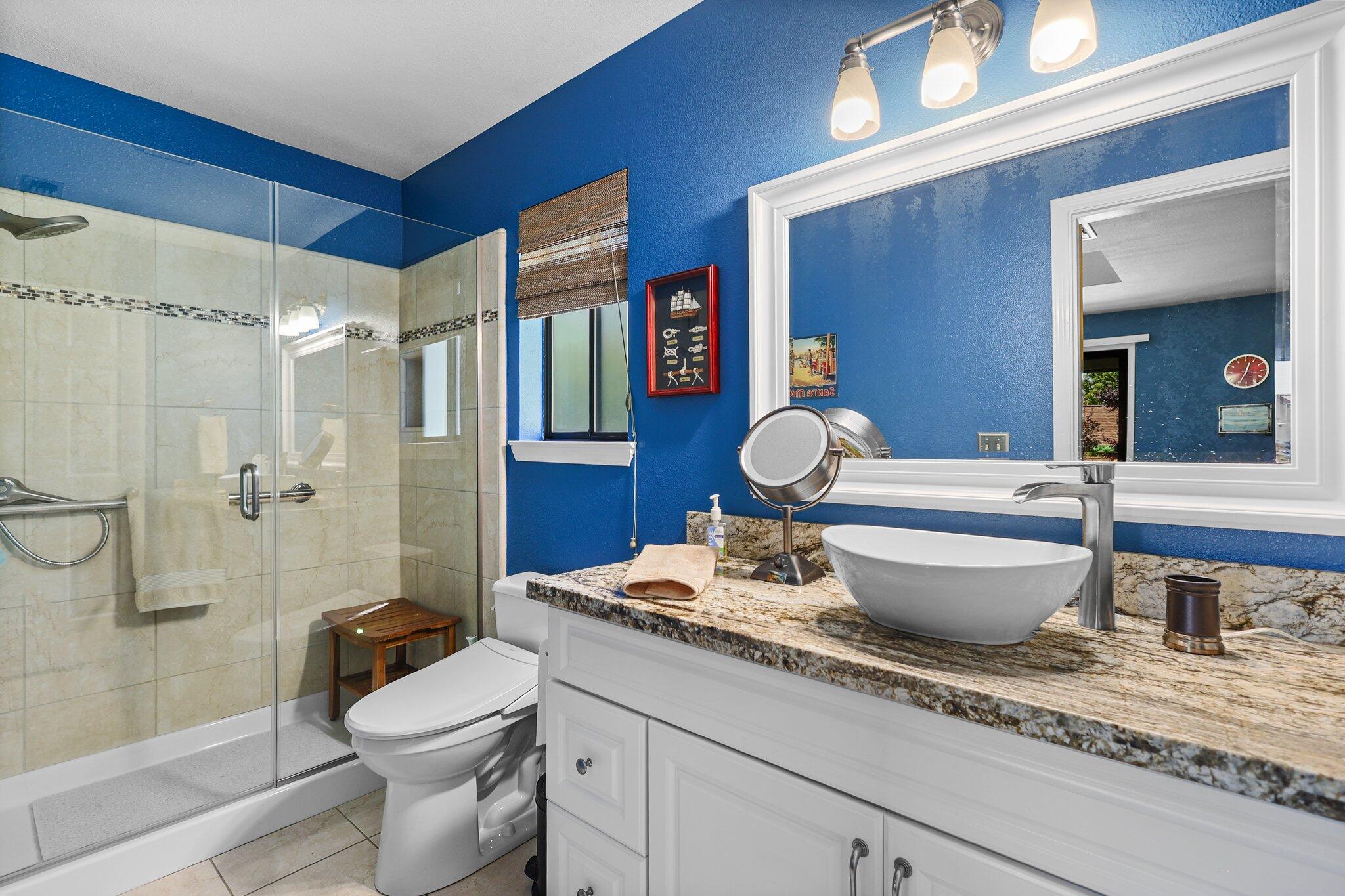 2788 Summerbreeze Place Redding, CA 96001 - Photo 15 of 28 a bath room with a toilet a sink and a shower