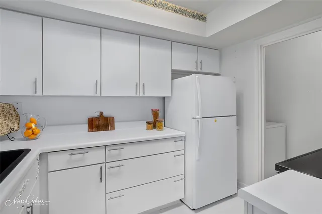 a kitchen with a stove and a microwave