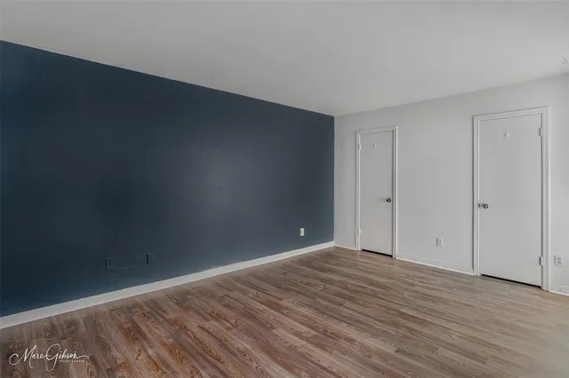 a spacious bathroom with a double vanity sink and a mirror