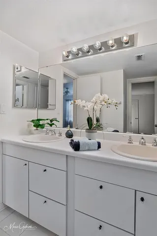 a view of a room with chandelier and wooden floor
